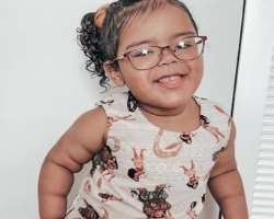 The cute little girl is often seen wearing glasses